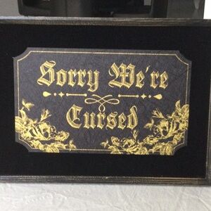 Black and Gold Decorative Sign